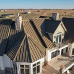 This home has standing seam metal roofing installed by Spotless & Seamless Exteriors.